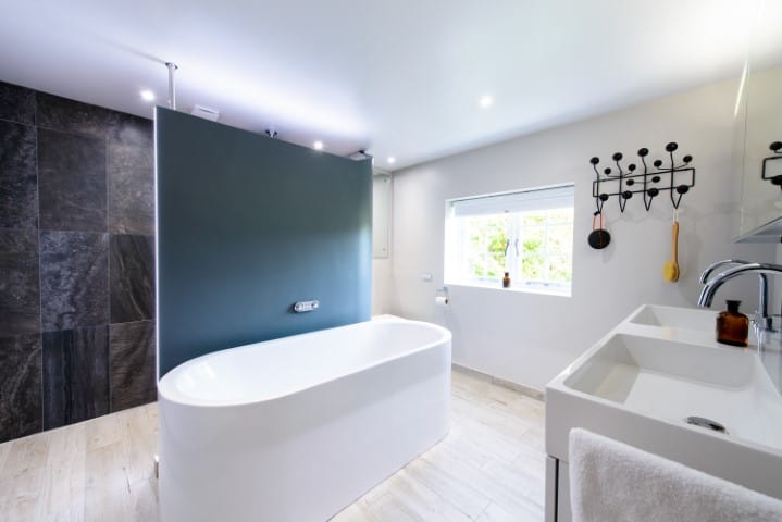 Photo of award winning bathroom with walk in shower and central feature bath